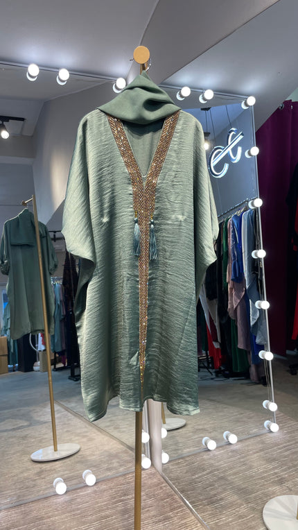 Kids Abaya made of Luxurious Harir Maqsoud Fabric in Musk Green color.