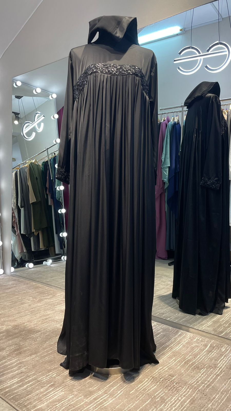 Black Pleated Satin Abaya Dress with Black embellishment.