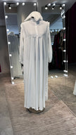 White umbrella Turtle neck with chiffon Flare shoulder.
